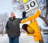 Tired of waiting for the city’s green light, Chuck Lewis installed a solar-powered beacon next to Winnipeg Mennonite Elementary. (Mikaela MacKenzie / Winnipeg Free Press)