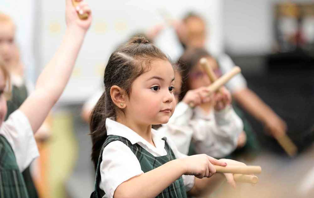 Kindergarten students, including Melissa Castillo, learned different ways of performing music through movement, dance and drumming. (Ruth Bonneville / Winnipeg Free Press)