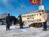 Demonstrators block a portion of the Canadian National rail line just north of Wilkes in Diamond, MB, Wednesday morning. (Danielle DaSilva / Winnipeg Free Press)