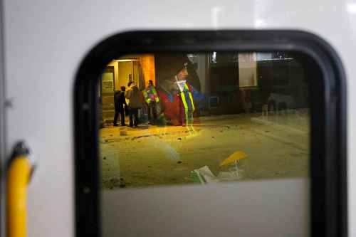 JOHN WOODS / WINNIPEG FREE PRESS
Salvation Army (SA) cadet John Burton, reflected in a vehicle window as people enter the shelter, feeds and supports people as they drive around in their Extreme Environment Response Vehicle in downtown Winnipeg Saturday, April 4, 2020. 

Reporter: Thorpe