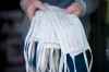 MIKAELA MACKENZIE / WINNIPEG FREE PRESS



Samatha Leclerc, general manager at Pollock's Hardware, shows off some of the cotton masks made my local newcomer women for sale in Winnipeg on Wednesday, April 15, 2020. For Katie May story.

Winnipeg Free Press 2020