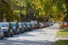 A line of cars of people waiting to get tested at the Main Street site was running down various residential streets for hours last week. (Mike Deal / Winnipeg Free Press files)