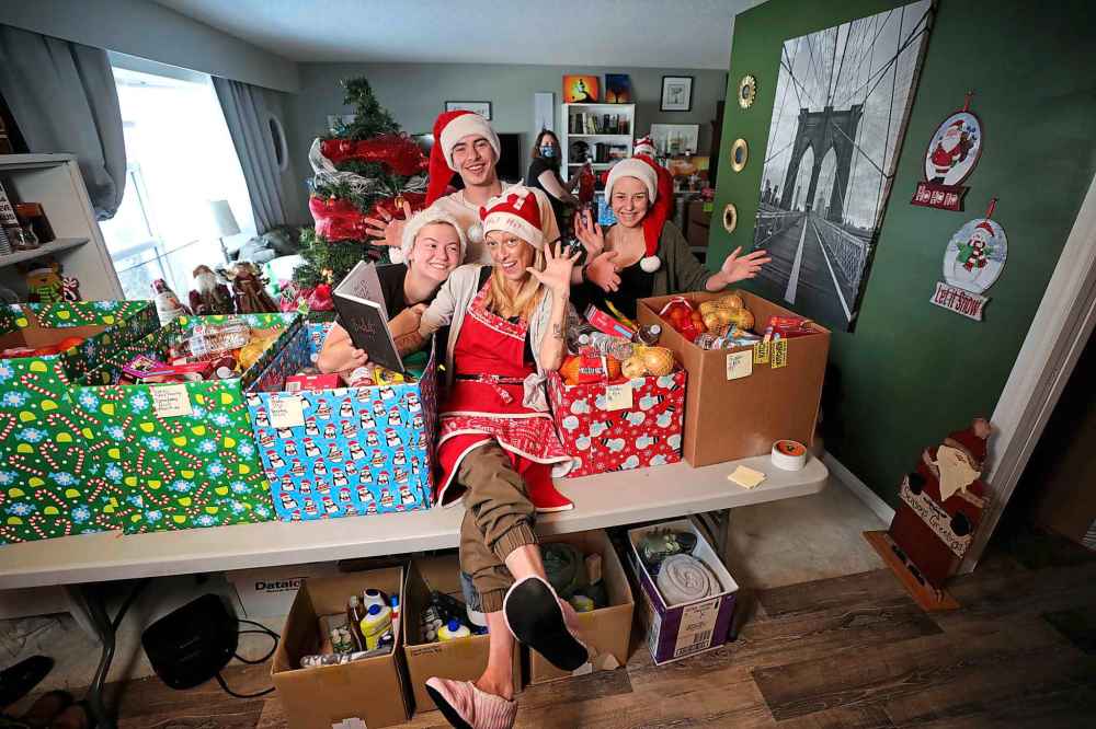 RUTH BONNEVILLE / WINNIPEG FREE PRESS

Jaime created South Winnipeg Assists Santa, a Fort Richmond community group that has put together Christmas hampers they will be delivering to 11 local families on Tuesday night.