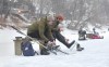 Erika Hoskins and Kerry Bosko get ready Tuesday for a skate on the Assiniboine River rink created by river lot owners in the area. (Ruth Bonneville / Winnipeg Free Press)