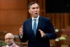 Finance Minister Bill Morneau rises during Question Period in the House of Commons in Ottawa, Monday, July 20, 2020. Morneau will appear today before a House of Commons committee that is probing a cancelled agreement for WE Charity to run a student-volunteer program.THE CANADIAN PRESS/Adrian Wyld