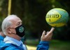 NDP Leader John Horgan spins a rugby ball on his fingers during a campaign stop at Stanley Park, in Vancouver, on Friday, October 2, 2020.THE CANADIAN PRESS/Darryl Dyck