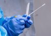 A health-care worker gets a swab ready at a temporary COVID-19 test clinic in Montreal, on Friday, May 15, 2020. THE CANADIAN PRESS/Paul Chiasson