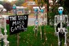 Coronavirus-themed Halloween decorations are displayed on a lawn in Tenafly, N.J., Thursday, Oct. 22, 2020. As spooky season reaches its climax in a particularly frightening year, some historians argue the COVID-19 pandemic offers an opportunity to explore a more cerebral side of Halloween. THE CANADIAN PRESS/AP Photo/Seth Wenig