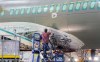 An Airbus employee works an Airbus A220 at the assembly plant in Mirabel, Que., Thursday, February 20, 2020. THE CANADIAN PRESS/Graham Hughes