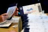 Chester County, Pa. election workers process mail-in and absentee ballots at West Chester University.   THE CANADIAN PRESS/AP, Matt Slocum