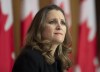 Deputy Prime Minister and Minister of Finance Chrystia Freeland listens to a question from a reporter on the phone during a news conference in Ottawa, Monday, Nov. 30, 2020. THE CANADIAN PRESS/Adrian Wyld