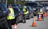 Paramedics register patients at a drive through, pop-up COVID-19 test centre outside the Canadian Tire Centre, home of the NHL's Ottawa Senators, in Ottawa, Sunday, Sept. 20, 2020. A new poll suggests most Canadians aren't currently worried that people in other countries might get a COVID-19 vaccine first. THE CANADIAN PRESS/Justin Tang