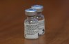 Two empty vials of the Pfizer-BioNTech COVID-19 vaccine sit on a table at the Ottawa Hospital Tuesday December 15, 2020 in Ottawa. THE CANADIAN PRESS/Adrian Wyld