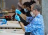 A nasal sample is processed at a pop-up COVID-19 testing site on the Dalhousie University campus in Halifax on Wednesday, Nov. 25, 2020. THE CANADIAN PRESS/Andrew Vaughan