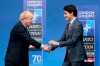 In this Wednesday, Dec. 4, 2019 file photo, British Prime Minister Boris Johnson, left, welcomes Canadian Prime Minister Justin Trudeau during official arrivals for a NATO leaders meeting at The Grove hotel and resort in Watford, Hertfordshire, England. THE CANADIAN PRESS/AP-Francisco Seco