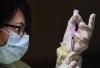 Francesca Paceri, a registered pharmacist technician, carefully fills the Pfizer-BioNTech COVID-19 mRNA vaccine at a vaccine clinic during the COVID-19 pandemic in Toronto on December 15, 2020. THE CANADIAN PRESS/Nathan Denette