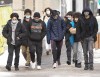 People walk downtown as COVID-19 lockdown measures continue in Montreal, Monday, January 18, 2021. THE CANADIAN PRESS/Ryan Remiorz