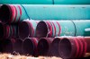 In this Dec. 18, 2020 photo, pipes to be used for the Keystone XL pipeline are stored in a field near Dorchester, Neb.  THE CANADIAN PRESS/AP-Chris Machian /Omaha World-Herald via AP