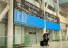 A lone passenger stands outside the International Arrivals area at Pearson Airport in Toronto on Tuesday, Jan. 26, 2021. As the federal government prepares to slap new restrictions on foreign arrivals, Health Canada data suggest a growing number of infections directly connected to international travel. THE CANADIAN PRESS/Frank Gunn