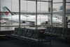 A plane is seen through the window on the tarmac of Vancouver International Airport as the waiting room is empty Tuesday, June 9, 2020. THE CANADIAN PRESS/Jonathan Hayward