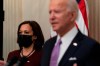 Vice President Kamala Harris, left, listens as President Joe Biden speaks about the coronavirus, in the State Dinning Room of the White House on January 21, 2021, in Washington. THE CANADIAN PRESS/AP, Alex Brandon