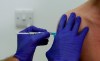 Phase 3 Novavax coronavirus vaccine trial vaccine volunteer Franklyn Howe is given an injection at St George's University hospital at in London, Wednesday, Oct. 7, 2020. Canada is taking steps towards producing COVID-19 vaccines domestically, announcing a tentative agreement with U.S. company Novavax on Tuesday to manufacture millions of doses of the shot once they're approved here. THE CANADIAN PRESS/AP/Alastair Grant