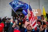 FILE - In this Jan. 6, 2021, file photo, Trump supporters gather outside the Capitol in Washington. Lawmakers in the United States are hearing chilling warnings about the growing threat of domestic extremism after last month's riots on Capitol Hill. THE CANADIAN PRESS/AP/John Minchillo, File