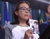 Debbie Baptiste, mother of Colten Boushie, holds a photo of her son during a press conference on Parliament Hill in Ottawa on Feb. 14, 2018. A newly released document show prosecutors in Saskatchewan weighed the backlash and remorse felt by those accused of posting hateful messages online after the high-profile death of the young Cree man. THE CANADIAN PRESS/Justin Tang