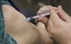 Seniors receive their COVID-19 vaccine at a clinic at Olympic Stadium marking the beginning of mass vaccination in the Province of Quebec based on age in Montreal, on Monday, March 1, 2021. THE CANADIAN PRESS/Paul Chiasson