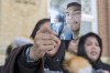 Debbie Baptiste, the mother of Colten Boushie, holds up a picture of her son, in Battleford, Sask., Monday, Feb. 5, 2018. A watchdog's report has been released into how Mounties handled the high-profile shooting death of the young Indigenous man in Saskatchewan. THE CANADIAN PRESS/Liam Richards