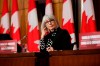 Health Minister Patty Hajdu listens at a COVID-19 press conference in Ottawa, Friday, Dec. 11, 2020. An interim examination of why the federal government's pandemic early warning system failed to send up a formal alert on COVID-19 has been released. THE CANADIAN PRESS/David Kawai