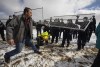 Supporters try to tear down the fence as police struggle with them outside GraceLife Church near Edmonton, Alta., on Sunday, April 11, 2021. The church has been fenced off by police and Alberta Health Services in violation of COVID-19 rules. THE CANADIAN PRESS/Jason Franson