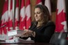 Minister of Finance Chrystia Freeland holds a copy of the budget as she packs up her papers at the end of a news conference in Ottawa, Monday April 19, 2021. Freeland will deliver the government's first budget since the COVID-19 pandemic began. THE CANADIAN PRESS/Adrian Wyld