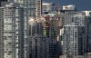 A condo tower under construction is pictured in downtown Vancouver on February 9, 2020. Experts and advocates say budget measures aimed at putting housing within reach of more Canadians mark a step in the right direction, despite a few ham-fisted moves. THE CANADIAN PRESS/Darryl Dyck