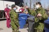 Canadian Armed Forces personnel arrive at the Villa Val des Arbes seniors residence, Monday, April 20, 2020 in Laval, Quebec. The federal government will announce this afternoon the provision of military medical personnel to help Ontario's beleaguered health-care system with a third wave of COVID-19. THE CANADIAN PRESS/Ryan Remiorz