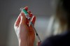 Dr. Joss Reimer, medical lead of Manitoba's vaccine implementation working group, draws a dose of the AstraZeneca COVID-19 vaccine at a clinic in Winnipeg on Friday, March 19, 2021. THE CANADIAN PRESS/John Woods