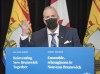 New Brunswick Finance Minister Ernie Steeves speaks at a news conference in the Legislature in Fredericton, N.B., on Tuesday, March 16, 2021. THE CANADIAN PRESS/Stephen MacGillivray