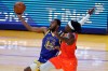 Golden State Warriors' Andrew Wiggins, left, shoots against Oklahoma City Thunder's Luguentz Dort during the first half of an NBA basketball game in San Francisco, Saturday, May 8, 2021. Fourteen NBA players are among 21 players invited to the Canadian national men's basketball team's training camp in Tampa, Fla. THE CANADIAN PRESS/AP/Jed Jacobsohn