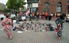 Two Indigenous dancers perform around the 215 pairs of children's shoes placed next to a Sir John A. Macdonald statue in Charlottetown on Monday, May 31, 2021, during a ceremony for the remains of 215 children found at the Kamloops Indian Residential School.THE CANADIAN PRESS/John Morris