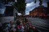 People sing and drum outside the former Kamloops Indian Residential School to honour the 215 children whose remains have been discovered buried near the facility, in Kamloops, B.C., on Monday, May 31, 2021. THE CANADIAN PRESS/Darryl Dyck