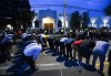 People pray at a vigil outside the London Muslim Mosque for the victims of the deadly vehicle attack on five members of the Canadian Muslim community in London, Ont., on Tuesday, June 8, 2021.THE CANADIAN PRESS/Nathan Denette