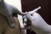 A man receives the Sinopharm COVID-19 vaccine at a vaccination center, in Kabul, Afghanistan, Wednesday, June 16, 2021. In Afghanistan, where a surge threatens to overwhelm a war-battered health system, 700,000 doses donated by China arrived over the weekend, and within hours, 