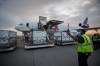 Workers unload a shipment of the Moderna COVID‑19 vaccine at the FedEx hub at Pearson International Airport in Toronto on Thursday, May 20, 2021. THE CANADIAN PRESS/Cole Burston