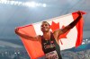 Andre de Grasse, of Canada, celebrates after winning the silver medal in the men's 200 meters at the World Athletics Championships in Doha, Qatar, Tuesday, Oct. 1, 2019. THE CANADIAN PRESS/AP, Hassan Ammar