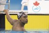 Joshua Liendo looks up at the board after winning the Men's 100m Butterfly at the 2020 Olympic Swimming Trials in Toronto on Saturday June 19, 2021. THE CANADIAN PRESS/Frank Gunn