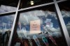 A message is seen on the window of the Sk'elep School of Excellence as the Canadian, Tk'emlups te Secwepemc and B.C. flags are reflected in the window flying at half mast to honour the 215 children whose remains have been discovered buried near the former Kamloops Indian Residential School, in Kamloops, B.C., on Saturday, June 5, 2021. A First Nation in southern Saskatchewan is to hold a virtual news conference Thursday morning about what it calls 