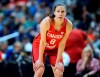 FILE- In this July 29, 2016, file photo, Canada's Kim Gaucher watches during a break in the second half of a women's exhibition basketball game in Bridgeport, Conn. Gaucher say she is being “forced to decide between being a breastfeeding mom or an Olympic athlete.” COVID-19 rules prevent her from bringing her daughter, Sophie, who was born in March, to the Tokyo Olympics next month. She says Olympic organizers have said “no friends, no family, no exceptions.” The 37-year-old Gaucher is looking into options, such as shipping milk, but has run into complications. (AP Photo/Jessica Hill, File)
