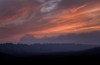 Smoke hangs above the treeline near dusk blocking out the setting sun at forest fires near Killarney, Ont., Tuesday, July 31, 2018.  THE CANADIAN PRESS/Fred Thornhill