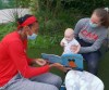 Canadian women's basketball team player Kim Gaucher holds her baby Sophie as teammate Kayla Alexander reads to her in Kariya City, Japan in a handout photo. THE CANADIAN PRESS/HO-Canada Basketball MANDATORY CREDIT