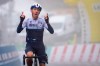 The winner of the stage Michael Woods from Canada of team Israel Start-Up Nation celebrates as he crosses the finish line during the 4th stage, a 161,3 km race between Sion and Thyon 2000 at the 74th Tour de Romandie UCI ProTour cycling race in Thyon-Les Collons, Switzerland, Saturday, May 1, 2021. THE CANADIAN PRESS/AP-KEYSTONE/Jean-Christophe Bott